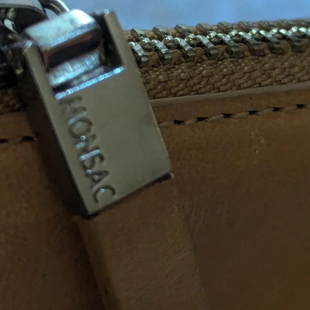 Monsac tan leather bag.